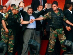 morsy.waving.to_.his_.supporters.in_.tahrir.29.june_.2012.jpeg