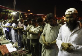 Supporters of ousted Egyptian President Mursi attend evening prayers in Giza