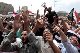 People attend a protest after Friday prayers in Tahrir Square in Cairo