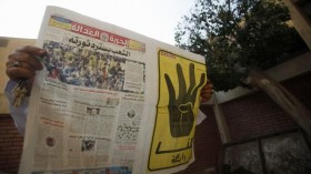 A man reads the Muslim Brotherhood's newspaper Al-Hurriya wa-l-adala, named after their political party, in Cairo