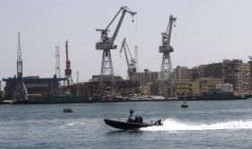 Naval units secure the area after protesters burned tyres in Port Said city