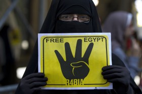 A woman holds up a sign at Dags Hammarskjold Plaza in New York